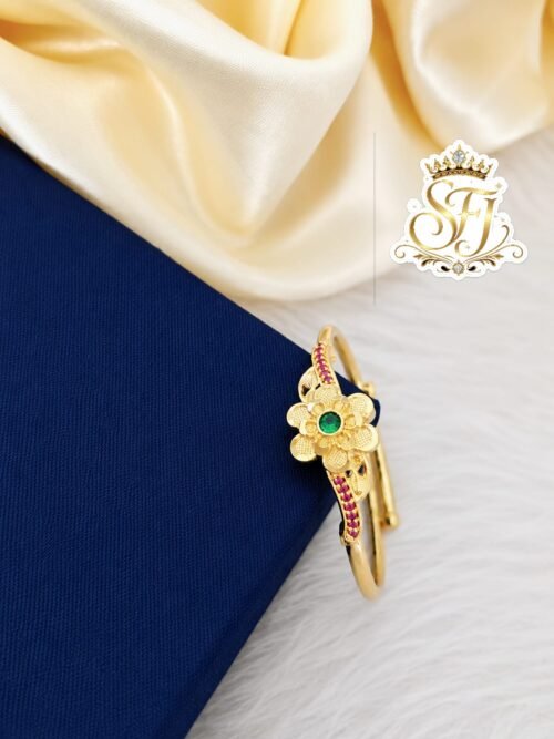 Gold covering adjustable floral finger ring with green center stone and ruby stone accents for women featuring a premium gold finish by SFJ Gold Covering.