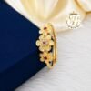 Gold covering ruby floral adjustable finger ring for women featuring ruby and white stone flower design with premium gold finish by SFJ Gold Covering.