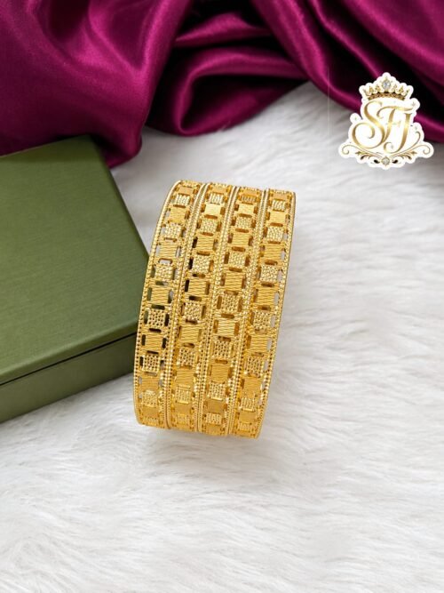 Premium gold finish designer bangles with geometric cutwork design, lightweight traditional imitation jewellery for bridal, festive and daily wear.