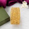 Premium gold finish geometric pattern designer bangles with intricate textured detailing, lightweight imitation jewellery for bridal, festive, and daily wear.