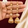 Premium gold finish long chain jhumka earrings with sparkling CZ stones, floral chain detailing, and traditional dome-shaped design for bridal and festive wear.