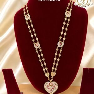 Premium gold finish heart pendant long haram with sparkling AD stones, ruby stone detailing, and heart link chain, perfect for bridal, wedding, and festive wear.