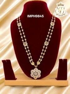 Impone floral pendant long haram with double heart chain design, gold finish traditional covering jewellery for women.