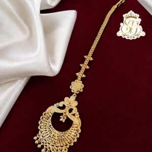 Premium traditional gold covering bridal maang tikka with intricate detailing.