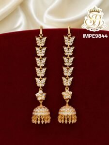 Gold finish butterfly design long jhumka earrings with sparkling AD stones and traditional hanging beads for bridal and festive wear.